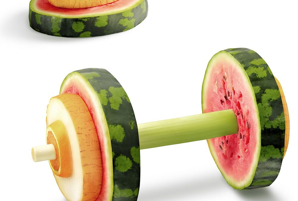 The photo of sport equipment made of healthy fruits full of vitamins.